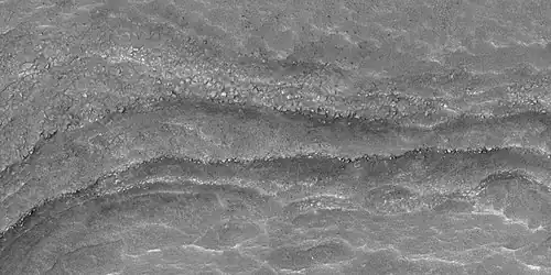 Close view of layers,  as seen by HiRISE under HiWish program. Some of the layers are breaking up into large blocks.