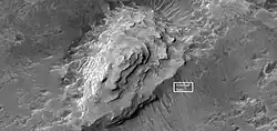 Close view of layered mound  in Crommelin crater, as seen by HiRISE.  Box indicates the size of a football field for scale.