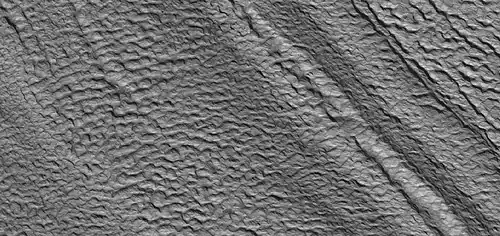 Close view of concentric crater fill, as seen by HiRISE under HiWish program  Concentric crater fill (CCF) is considered to be glacier-like in that it has ice below and thin layer of debris.  The debris layer prevents the ice from escaping into the air.