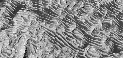 Close view of layers on floor of Danielson Crater, as seen by HiRISE under HiWish program.  Some faults are visible in image.