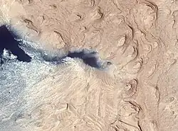 Crommelin crater layered deposit, as seen by HiRISE.  The color blue in the photo is a false color.