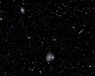 The large spiral galaxy in the center of this image is roughly 385 million light-years from Earth.