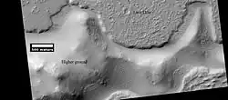 Lava flow.  Lava flow stopped when it encountered the higher ground of a mound.  Picture was taken with HiRISE under HiWish program.