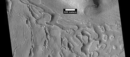 Evolution of ribbed terrain from stress cracks—cracks to the left eventually will enlarge and become ribbed terrain toward the right side of picture, as seen by HiRISE under HiWish program