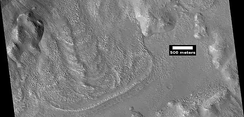 Glacier coming out of valley, as seen by HiRISE under HiWish program. Location is rim of Moreux Crater.  Location is Ismenius Lacus quadrangle.