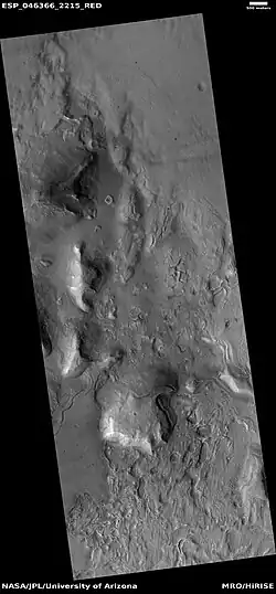 Wide view of fractured ground,  as seen by HiRISE under HiWish program. Cracks form on the Martian surface, and then they turn into large fractures.