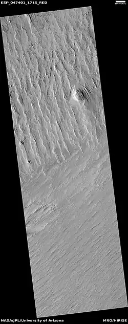 Wide view of yardangs, as seen by HiRISE under HiWish program. This image is odd in that the yardangs are lined up in different directions in the top and bottom part of image.  The wind direction probably changed to cause this.