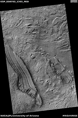 Tilted layers, as seen by HiRISE under HiWish program. Location is Hellas quadrangle.