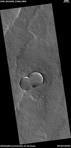 Double crater, as seen by HiRISE under HiWish program  Here the impacting body broke into two right before it struck the ground.