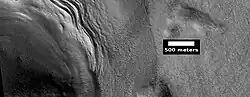 Close view of lobate debris apron around mesa, as seen by HiRISE under HiWish program Brain terrain is visible.