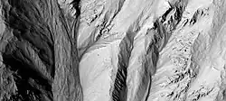Gully alcoves as seen by HiRISE under HiWish program  This image was named HiRISE Picture of the Day for June 25, 2024.