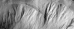Gullies in a crater, as seen by HiRISE under HiWish program  This image was named HiRISE Picture of the Day for June 25, 2024.