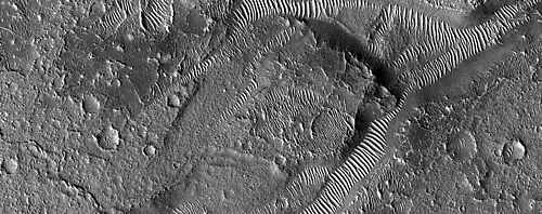 Transverse Aeolian Ridges (TAR's) as seen by HiRISE through HiWish program.  TAR's are visible in the low areas.