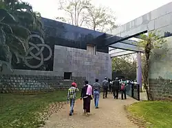 entrance with logo of the institute inscribed on the let wall