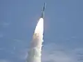 Fire and smoke light up a blue sky as a United Launch Alliance Delta II Heavy rocket propels GRAIL into space.