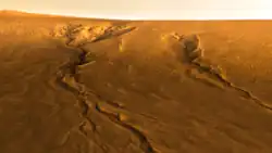 Gullies on central uplift of Lyot crater, image reprocessed from HiRISE data.