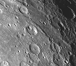 Hero Rupes is a long arcuate lobate scarp visible on this image. Mariner 10 image 0166842.
