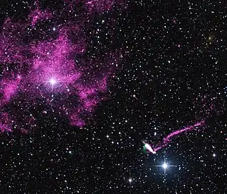 Composite image of IGR J11014-6103 and MSH 11-61A that contains data from NASA's Chandra X-ray Observatory (purple), radio data from the Australia Compact Telescope Array (green), and optical data from the 2MASS survey (red, green, and blue)