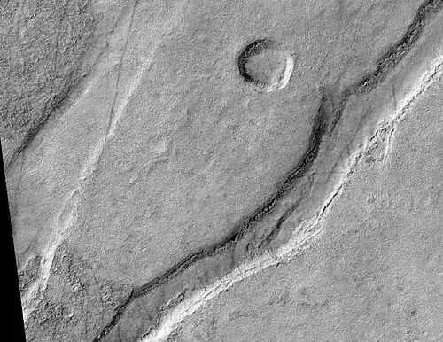 Icaria Fossae Graben, as seen by HiRISE.  Click on image for a better view of Dust Devil Tracks.
