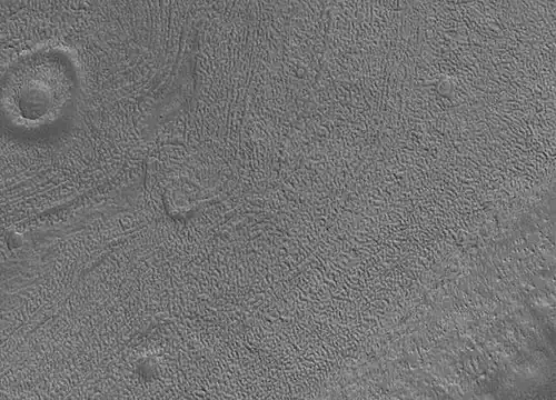 Close up image of Phaethontis surface taken by Mars Global Surveyor, under MOC Public Targeting Program.  Pits are thought to be caused by buried ice turning into a gas.