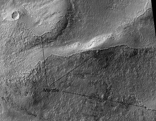 Ptolemaeus Crater Rim, as seen by HiRISE.  Click on image to see excellent view of mantle deposit.