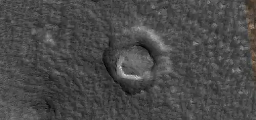 Ring mold crater.  Ring mold craters are caused by a rebound of an ice layer after being struck by an impacting body.