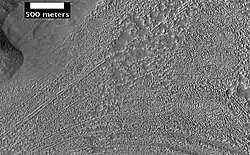 Complex surface around mound in Deuteronilus Mensae, as seen by HiRISE, under the HiWish program.  Location of this image is in the black box labeled B in the CTX image above.