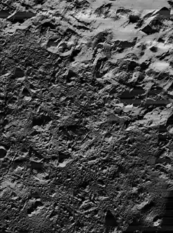 Lunar Orbiter 5 image of the northeastern crater floor, showing irregular surface of cracked impact melt.  Illumination is from lower right.
