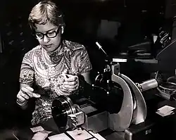 Photo of Rubin adjusting part of a large telescope