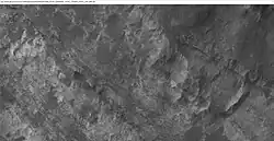 Layers in a valley East of Terby Crater, as seen by HiRISE under HiWish program.  Location is Iapygia quadrangle.