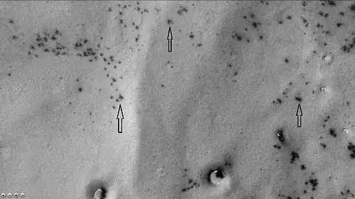 Dark spots and "spiders" in Joly crater, as seen by CTX camera (on Mars Reconnaissance Orbiter).  "Spiders" appear as fuzzy spots; they are where dark dust is accumulating in channels below clear slabs of frozen carbon dioxide.  Note: this is an enlargement of the previous image of Joly crater.