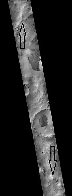 Schmidt (Martian crater), as seen by CTX camera (on Mars Reconnaissance Orbiter).  Arrows indicate the north and south rims of crater.