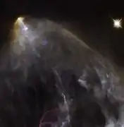 A wider view of the region (HL Tauri out of fram at bottom right corner) from the Hubble Space Telescope in visible light shows the Herbig–Haro object HH 150.