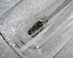Small (a few cm) piece of silvery-gray metal in a sealed vial