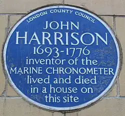 Blue plaque commemorating Harrison in Red Lion Square in London