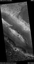 Her Desher Vallis, as seen by HiRISE.  Her Desher Vallis is found in the Coprates quadrangle.