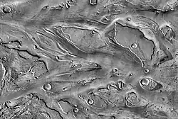 View of streamlined landforms in the Kasei Valles (detail from THEMIS mosaic at left).
