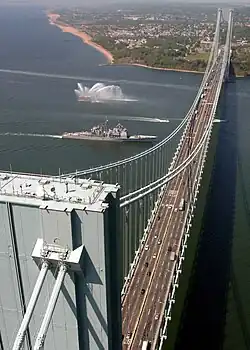 The Verrazzano-Narrows Bridge, shown with the  United States Navy warship USS&nbsp;Leyte Gulf (CG-55)  passing underneath it, spans The Narrows