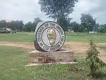 A sculpture with the words "In defence of the unborn child. Stop abortion." and a stylised fetus.