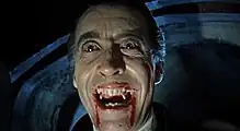 Film still of Christopher Lee wearing red contact lenses