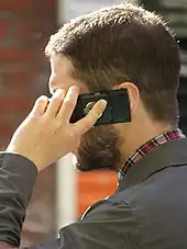 A man speaking on a mobile telephone