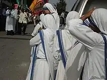 Missionaries of Charity wearing the traditional Sari during a religious procession in the streets of Port-au-Prince, Haiti, on the occasion of the feast of Saint Perpetua.