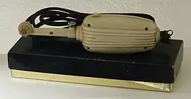 A photo of a Motodent electric toothbrush on top of a box.