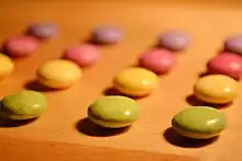 Sweets sorted by colour and aligned in rows and columns