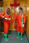 CDC microbiologists in Delta Protection "Orange Suits"