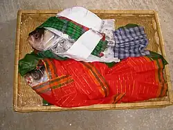 A pair of fish is given to the bride by the groom's family as a gift of Gaye Holud in Bangladeshi weddings.