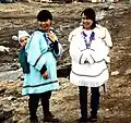 Two Inuit women wearing amautiit (skirted style, akuliq) in Nunavut (1995)