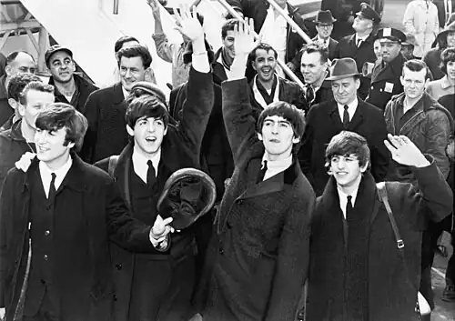 The Beatles arrive at the John F. Kennedy International Airport, New York City (1964).