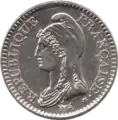 Monedă de 1 franc francez (ediţia 1992); avers: circular, RÉPUBLIQUE FRANÇAISE•; cap spre stânga, Marianne purtând bonetă frigiană; margini perlate