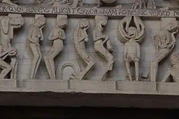 Demonii îi înșfacă pe cei damnați pentru ai trage în infern / în iad.